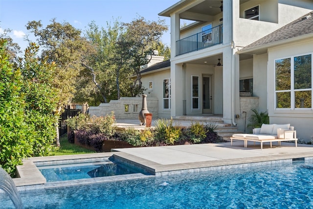 view of swimming pool featuring an in ground hot tub and a patio