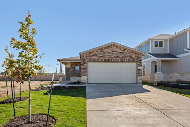 view of front of property with a front lawn and a garage