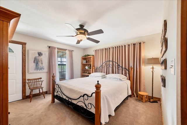 bedroom featuring ceiling fan and light colored carpet