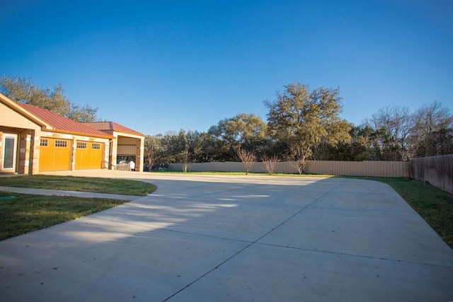 exterior space with a yard and fence