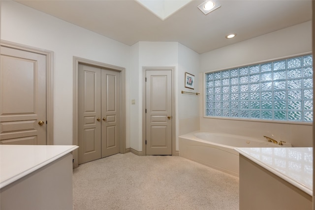 bathroom featuring a bath and vanity