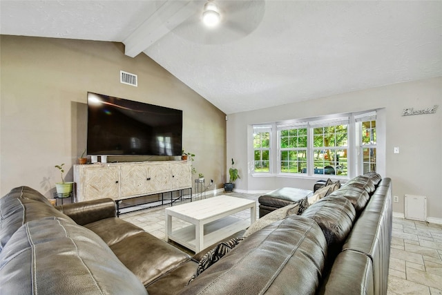 living room with ceiling fan and lofted ceiling with beams