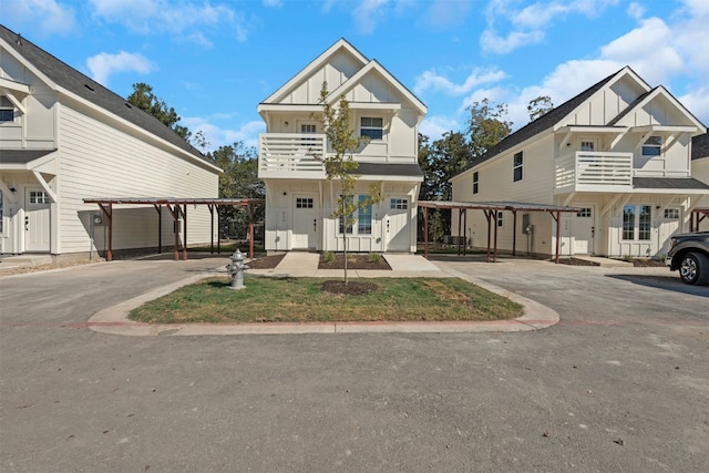 view of front of house featuring a balcony