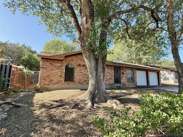 single story home with a garage