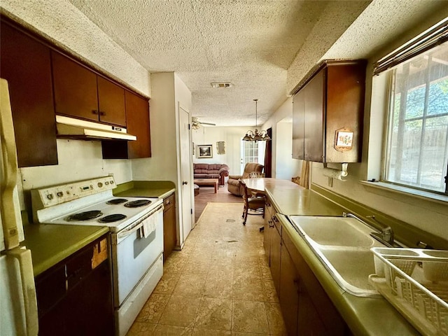 4710 Craigwood Dr, Austin, TX 78725 - kitchen with white range with electric cooktop, under cabinet range hood, a textured ceiling, a chandelier, and open floor plan