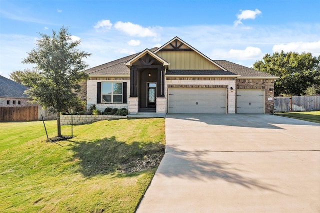 craftsman house featuring a garage and a front lawn