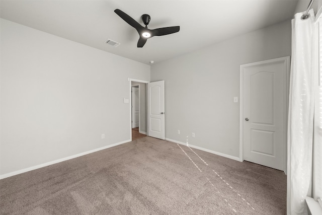 unfurnished bedroom featuring carpet and ceiling fan