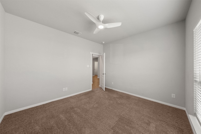 carpeted empty room with ceiling fan