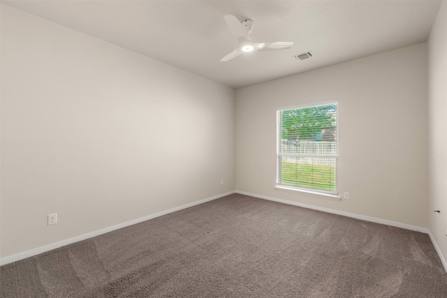 spare room with carpet and ceiling fan