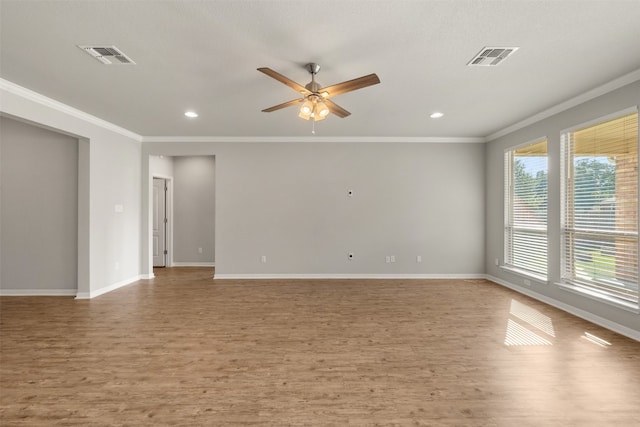 spare room featuring ceiling fan, crown molding, and light hardwood / wood-style floors