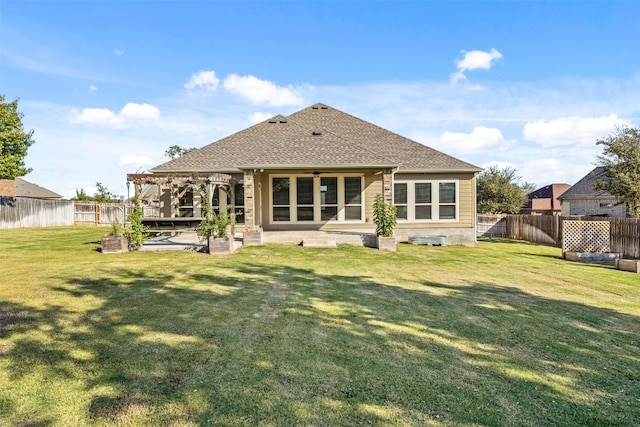 back of property with a lawn, a patio area, and ceiling fan