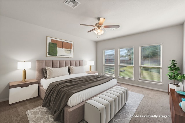 bedroom featuring ceiling fan and carpet