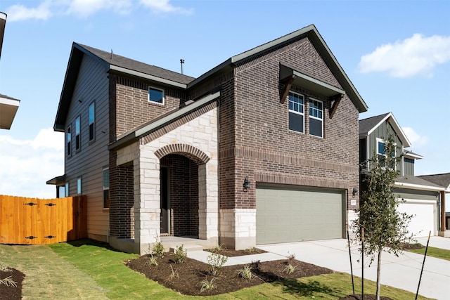 view of front of home featuring a front yard and a garage