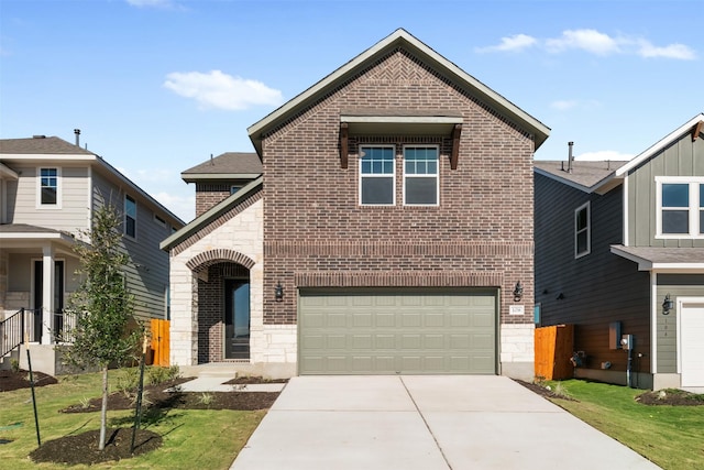 view of front of property featuring a front yard and a garage