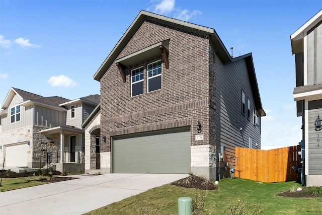 view of front of house featuring a front lawn and a garage