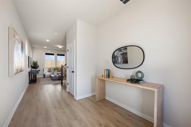 corridor featuring light hardwood / wood-style floors