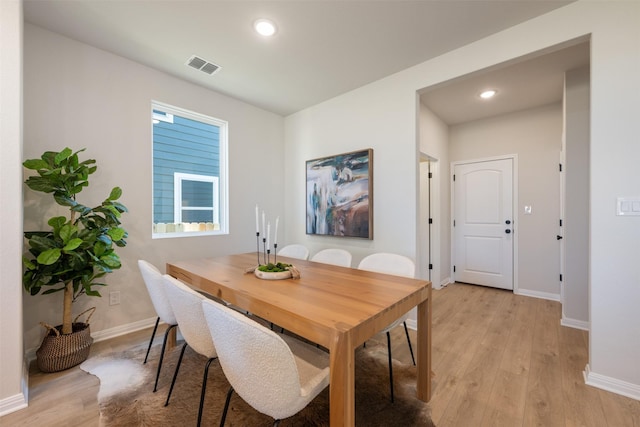 dining room with light hardwood / wood-style flooring