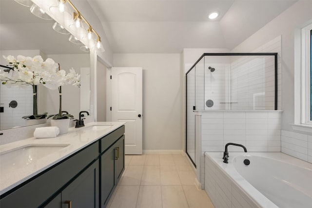 bathroom with tile patterned flooring, vanity, and independent shower and bath