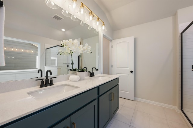 bathroom with tile patterned floors, vanity, a shower with shower door, and vaulted ceiling