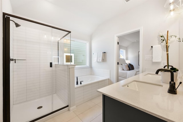 bathroom with plus walk in shower, tile patterned flooring, vanity, and lofted ceiling