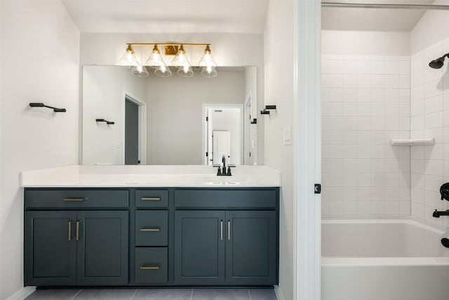 bathroom featuring vanity, tiled shower / bath combo, and tile patterned floors