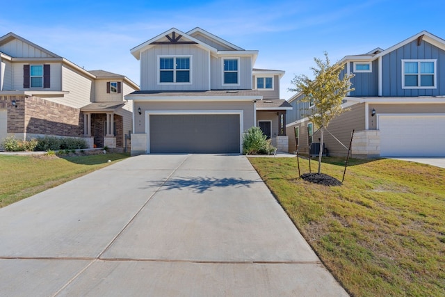 craftsman-style house with a garage and a front lawn