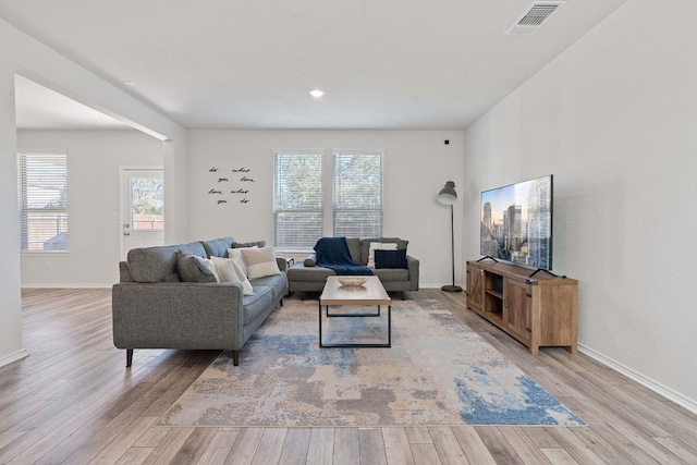 living room with light hardwood / wood-style floors