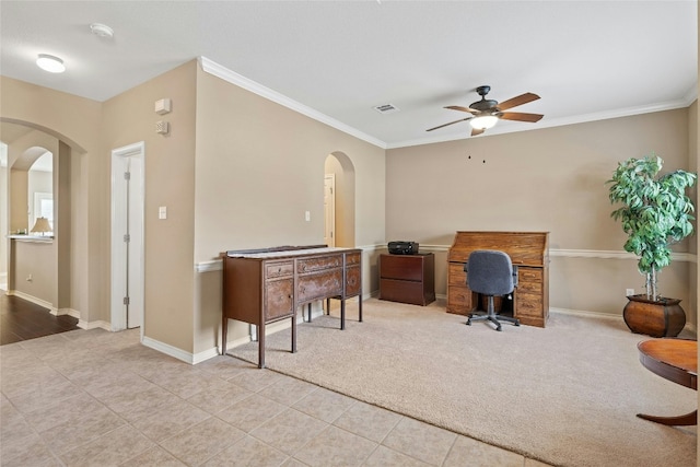 2603 White Stallion Way, Leander, TX 78641 - office area with arched walkways, a ceiling fan, ornamental molding, light tile patterned floors, and light colored carpet