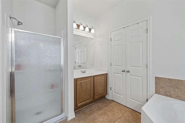 2603 White Stallion Way, Leander, TX 78641 - full bathroom featuring a shower stall, tile patterned flooring, vanity, and a bath