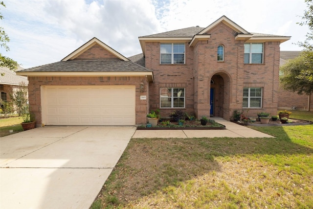 2603 White Stallion Way, Leander, TX 78641 - traditional-style house with brick siding, an attached garage, concrete driveway, a front lawn, and roof with shingles