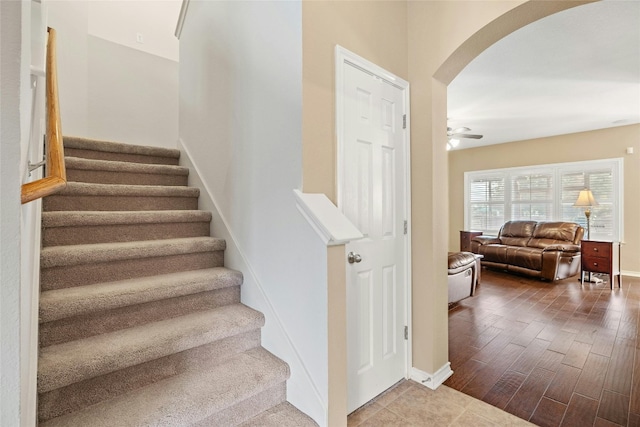 2603 White Stallion Way, Leander, TX 78641 - stairs with arched walkways, wood finished floors, and ceiling fan