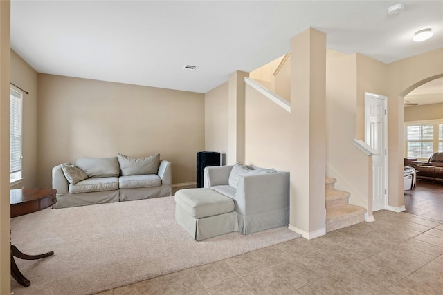 2603 White Stallion Way, Leander, TX 78641 - living area with arched walkways, stairs, and light tile patterned flooring