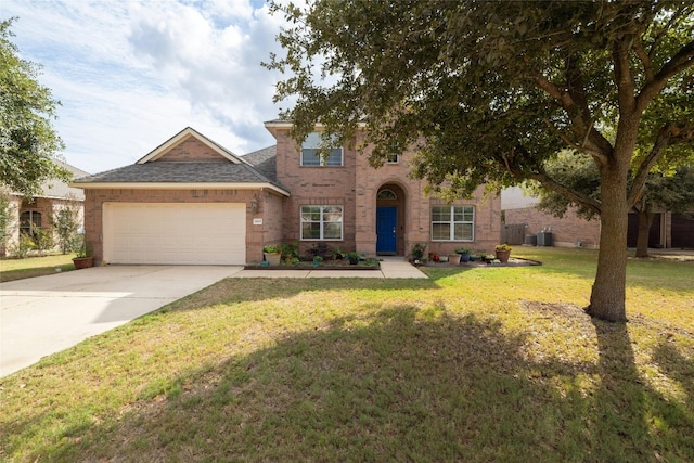 2603 White Stallion Way, Leander, TX 78641 - view of front of home featuring a garage, driveway, a front yard, and brick siding