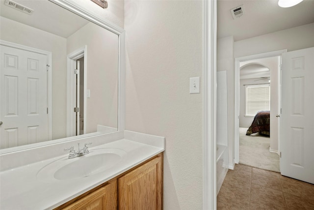 2603 White Stallion Way, Leander, TX 78641 - full bath featuring vanity, tile patterned floors, and a tub to relax in