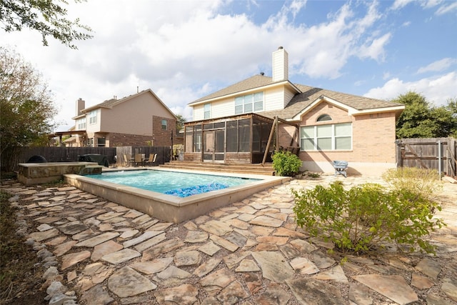 2603 White Stallion Way, Leander, TX 78641 - view of swimming pool featuring a sunroom, a fenced backyard, and a patio
