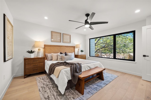 bedroom featuring ceiling fan and light hardwood / wood-style flooring