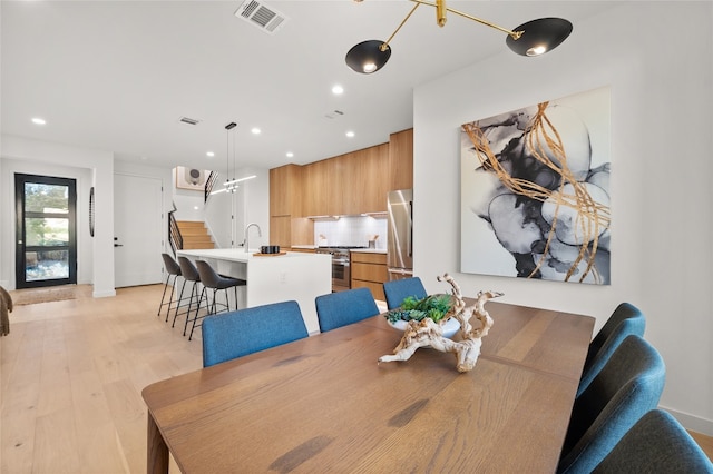 dining room with light hardwood / wood-style floors