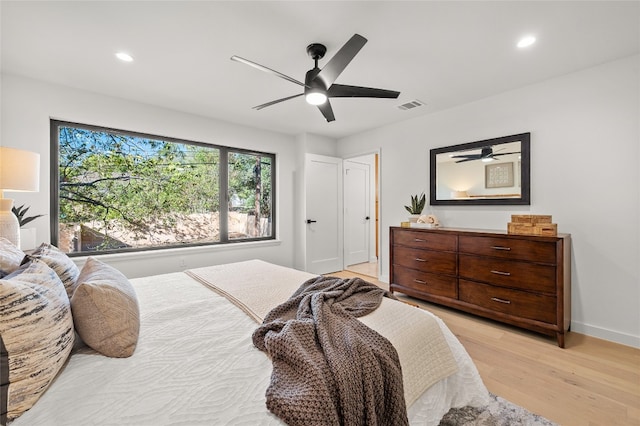 bedroom featuring ceiling fan and light hardwood / wood-style flooring