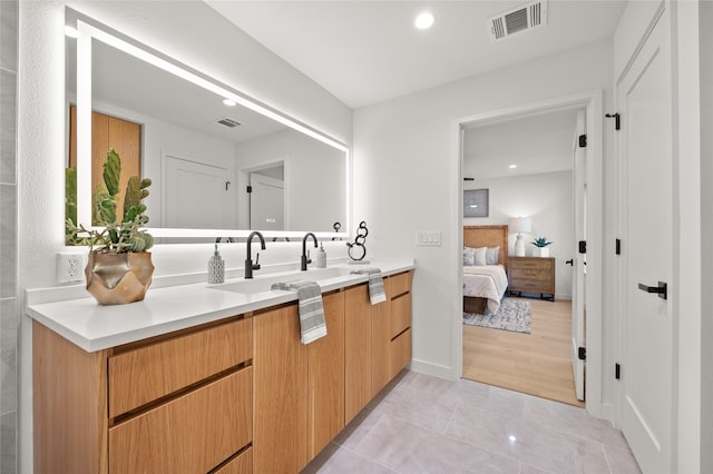 bathroom with vanity and hardwood / wood-style flooring