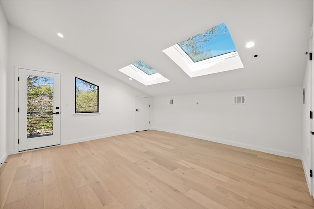 bonus room with light hardwood / wood-style floors and vaulted ceiling