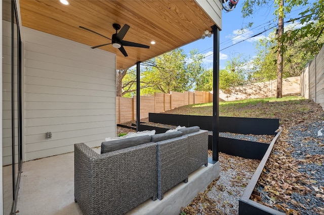 view of patio / terrace with ceiling fan and an outdoor living space