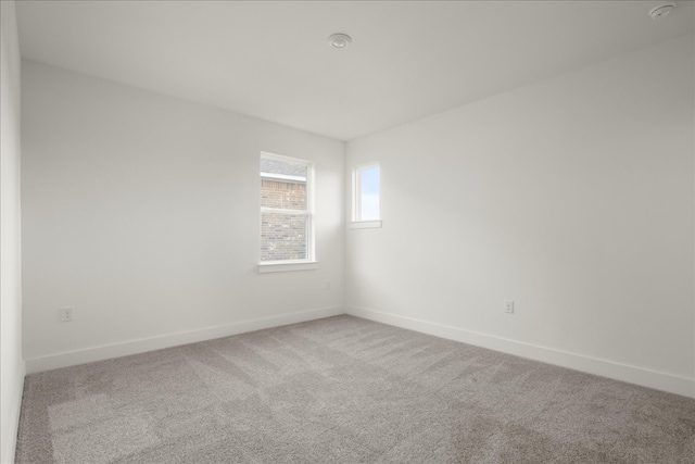 unfurnished room featuring carpet flooring