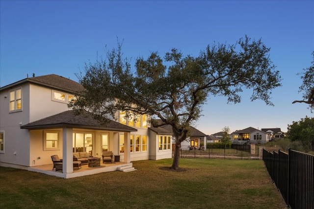 exterior space with a yard, an outdoor hangout area, and a patio area