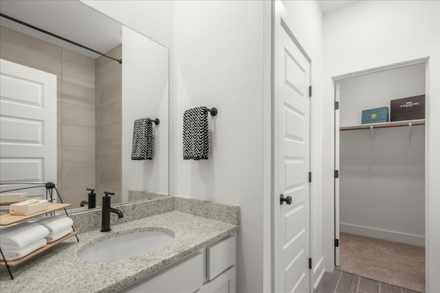 bathroom featuring vanity and hardwood / wood-style flooring