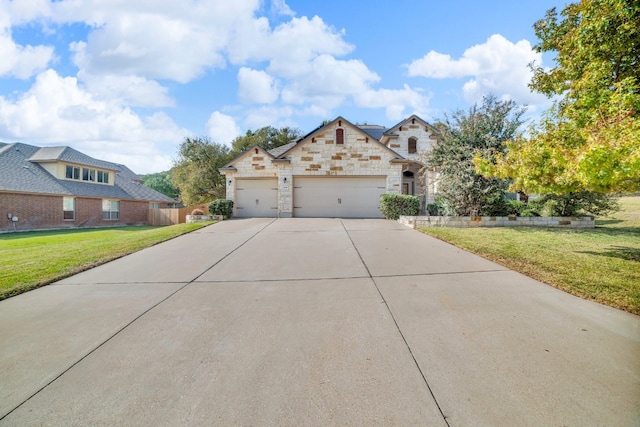 view of front facade with a front yard and a garage