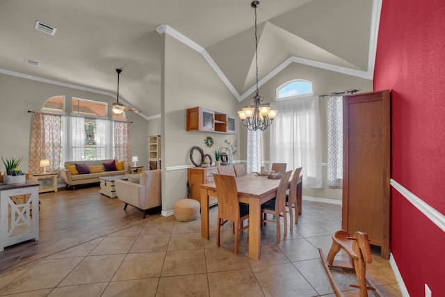 dining area featuring light hardwood / wood-style flooring, a wealth of natural light, and vaulted ceiling