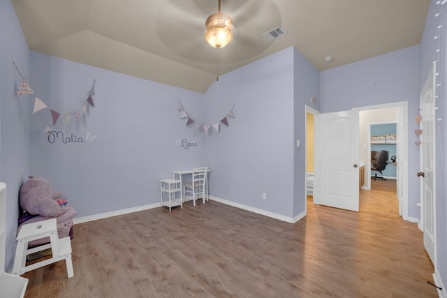 playroom featuring light wood-type flooring and ceiling fan