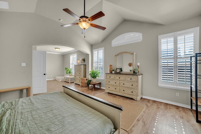 bedroom with multiple windows, ceiling fan, and light hardwood / wood-style floors