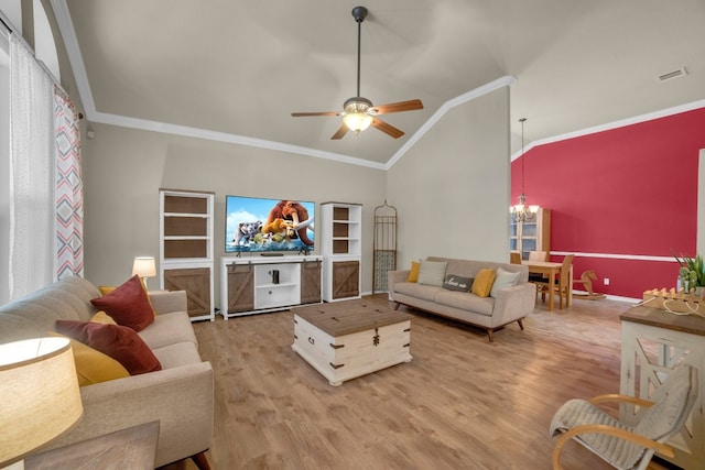 living room featuring crown molding, hardwood / wood-style floors, ceiling fan with notable chandelier, and vaulted ceiling