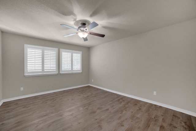 unfurnished room with ceiling fan, a textured ceiling, and hardwood / wood-style flooring